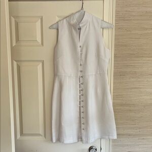 White midi linen dress with very small spot in front.